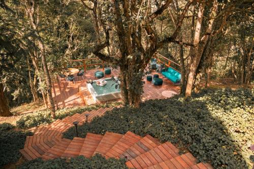 an overhead view of a playground with a tree at Botanique Hotel Experience - Campos do Jordão in Campos do Jordão