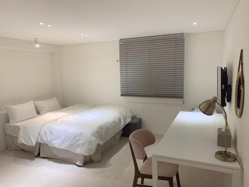 Postel nebo postele na pokoji v ubytování Yun's hotel
