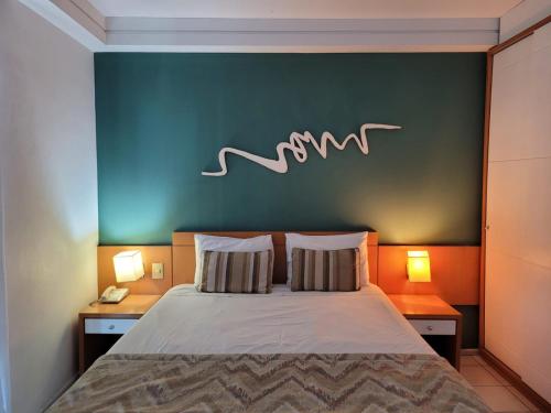 Кровать или кровати в номере Praia do Canto Apart Hotel - 302A Vista Mar