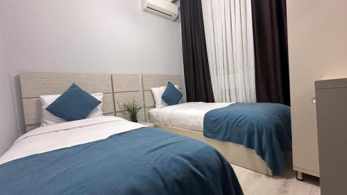 Ein Bett oder Betten in einem Zimmer der Unterkunft Overland Residence