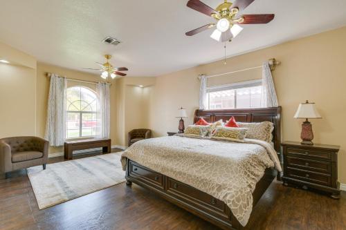 a bedroom with a bed and a ceiling fan at Luxe Yuma Home with Private Pool! in Yuma