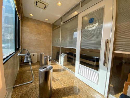 a lobby of a store with a trash can at Sun Hotel Tosu Saga - Vacation STAY 49480v in Tosu