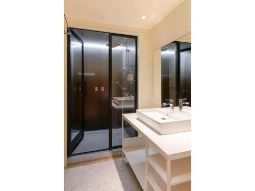 a bathroom with two sinks and a shower at THE BOLY OSAKA - Vacation STAY 52833v in Osaka