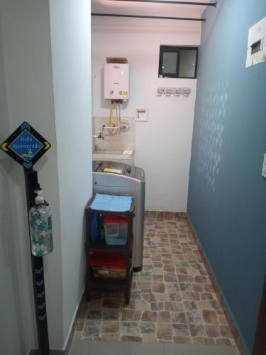 a hallway with a sink in a room at Apartamento Ángel Namaste in Bello
