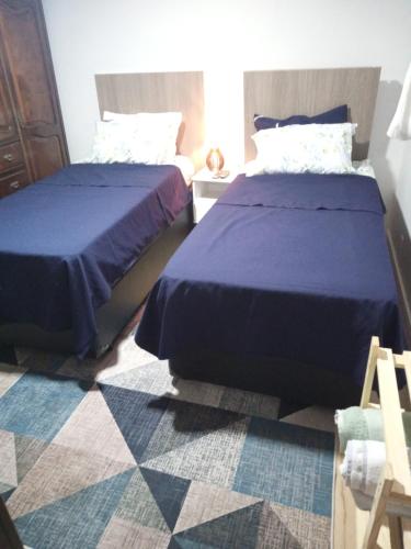Кровать или кровати в номере Suíte confortável - banheiro privativo!
