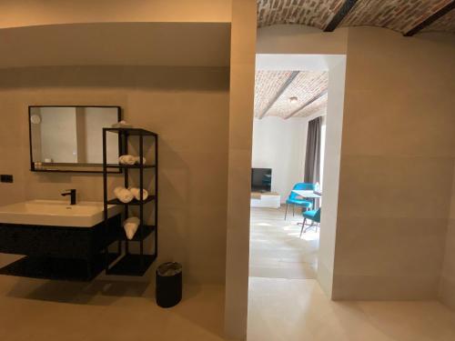 a bathroom with a sink and a mirror on the wall at HVN10 - Near Antwerp in Stabroek