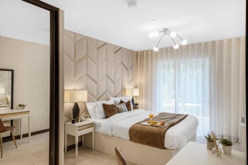 a bedroom with a large bed and a mirror at The WaterHouse Avenue by Kandara 5 Star City Home in Maidstone in Maidstone
