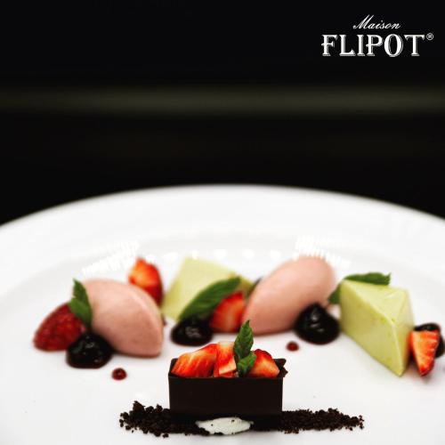 a plate of desserts on a white plate at Maison Flipot in Torre Pellice