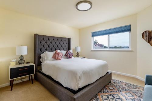 a bedroom with a large bed and a window at Dolphin in Marina