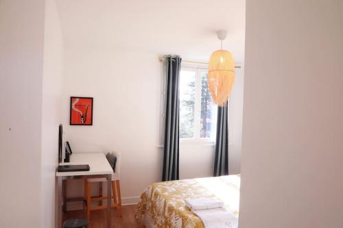 Katil atau katil-katil dalam bilik di T3 Lyon 8 parc parilly-Eurexpo -9min en voiture