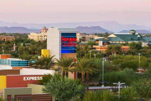 a city with a sign that reads kings quarters at Hampton Inn & Suites Phoenix Glendale-Westgate in Glendale