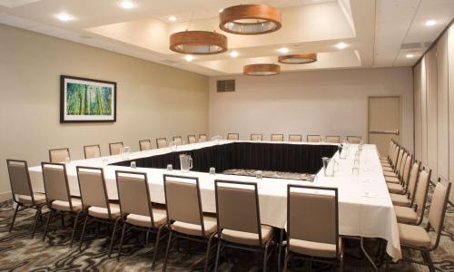 a conference room with a long table and chairs at Embassy Suites by Hilton Cincinnati Northeast - Blue Ash in Blue Ash