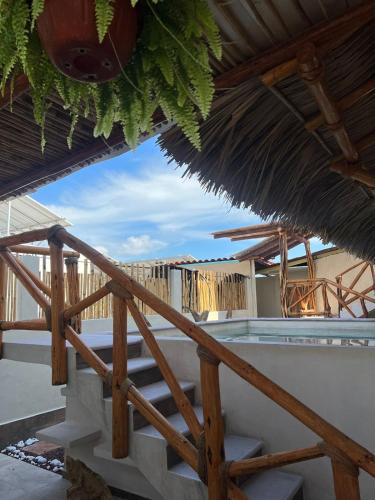 a view from the stairs of a resort with a roof at Hotel Casa-Noria Acapulco in Acapulco