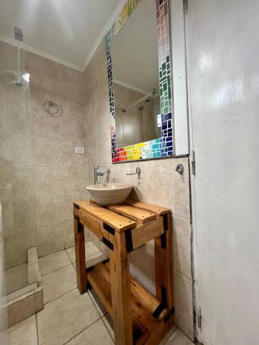 a bathroom with a sink and a mirror at CASA CONTENEDOR in Necochea