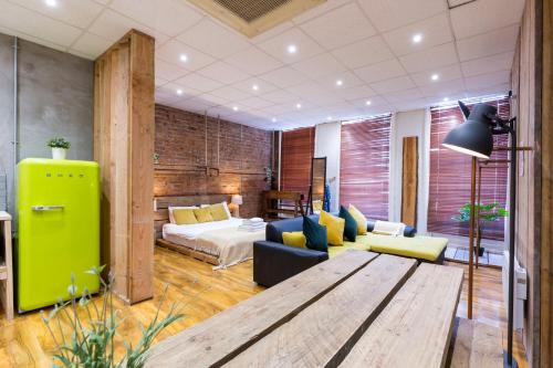 a room with a couch and a bed and a table at City Centre Vintage Chic Studio in Manchester