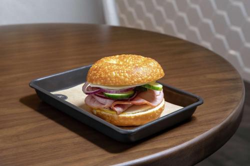 a sandwich in a container on a table at Embassy Suites By Hilton Knoxville Downtown in Knoxville