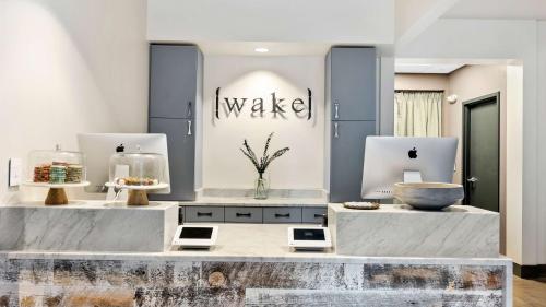 a makeup room with a counter with a sink at Embassy Suites By Hilton Knoxville Downtown in Knoxville