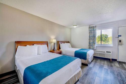 Ένα ή περισσότερα κρεβάτια σε δωμάτιο στο Motel 6 Harrisburg PA Near PA Expo Center