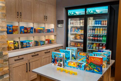 a store with a refrigerator filled with lots of food at Homewood Suites By Hilton Rancho Cordova, Ca in Rancho Cordova