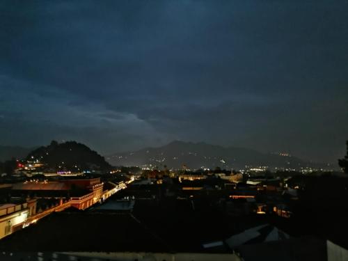 a view of a city at night at Casa Venus in San Cristóbal de Las Casas