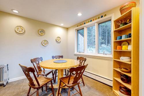 a dining room with a table and chairs and a window at Rustic Escape in Franconia
