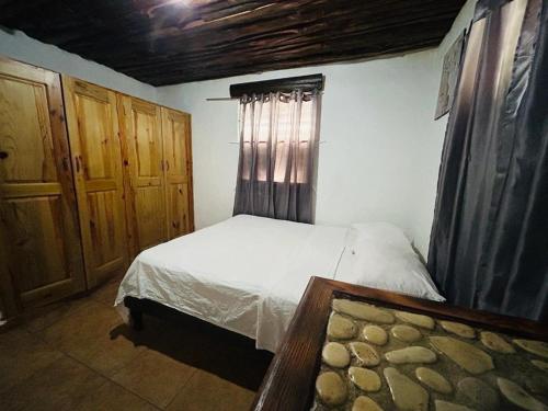 En eller flere senge i et værelse på Villa La Montaña