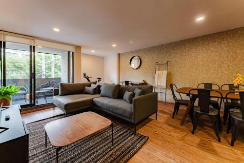 a living room with a couch and a table at Sonora 11 Apartments by VH in Mexico City