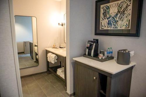 a bathroom with a sink and a mirror at Quinault Beach Resort & Casino in Ocean Shores