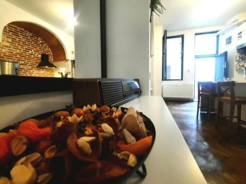 a bowl of food on a table in a room at Timisoara Central 2 Bedroom Hotel Serviced Belle Vue Apart By the Park in Timişoara