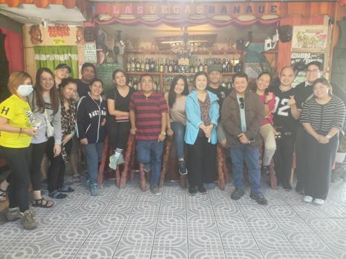 a group of people standing in front of a bar at Las vegas lodge and restaurant in Banaue