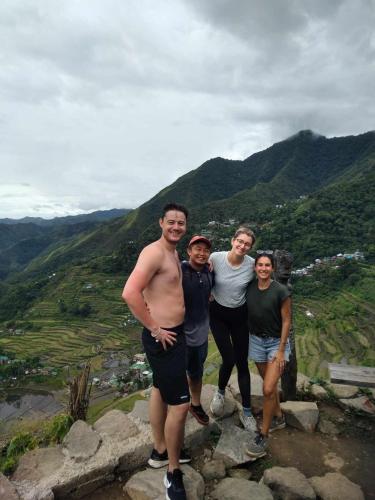 a group of people standing on top of a mountain at Las vegas lodge and restaurant in Banaue