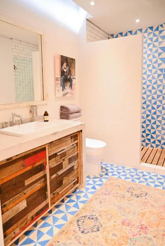 a bathroom with a sink and a mirror at Canela Fina - Adults Only in San Miguel de Allende