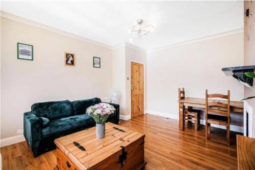 a living room with a couch and a table at Walthamstow 1 bed in London