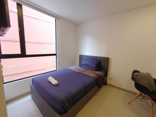 Giường trong phòng chung tại Apto Chapinero: Terraza y Vista