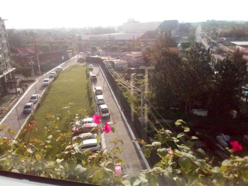 a view of a street with cars parked on the road at Camella Manor Majorca 7A in Bacolod