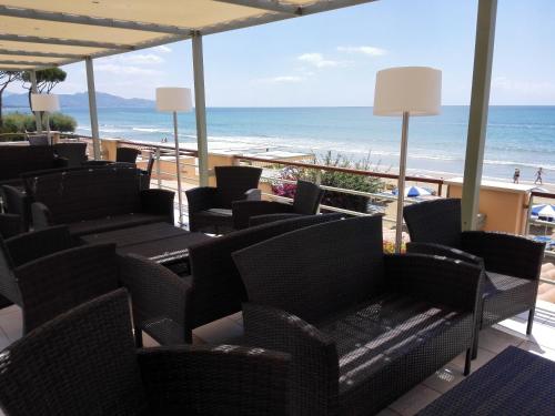 a view of the beach from a resort patio at Hotel Acquasanta in Terracina