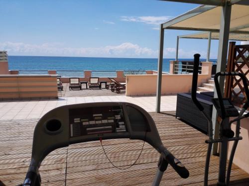 a view of the ocean from a device on a deck at Hotel Acquasanta in Terracina
