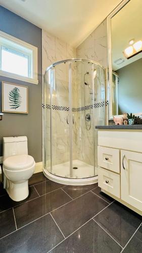 a bathroom with a shower and a toilet at Quiet Room in Richmond in Richmond