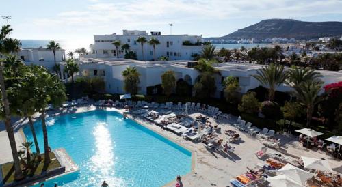 an overhead view of a swimming pool in a resort at Royal Decameron Tafoukt Beach Resort & Spa - All Inclusive in Agadir