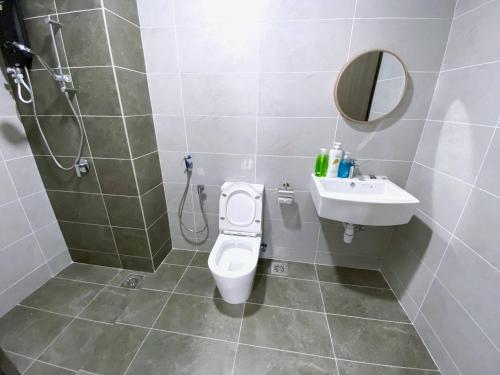 a bathroom with a toilet and a sink at Twin Tower Residence JB City by SC Homestay in Johor Bahru
