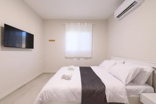 Cama o camas de una habitación en דירת נופש התבור Hatvor condo