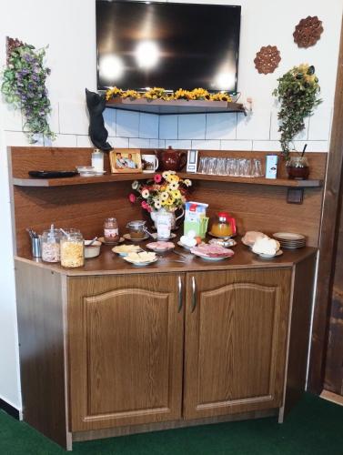 a counter in a kitchen with food on it at Pension Sport Ostružná in Ostružná
