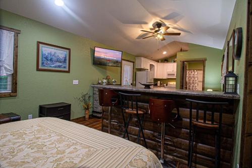 a living room with a bar and a kitchen at The Lil House in Robbinsville