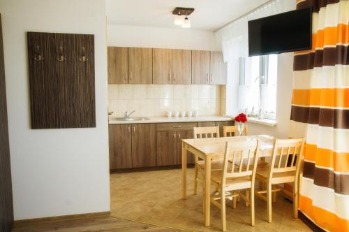 Dapur atau dapur kecil di Mazurski Zakątek-Apartamenty