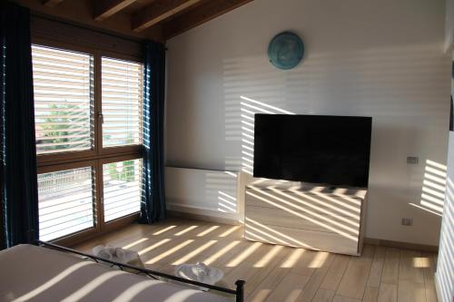 a living room with a large flat screen tv at Villa TaDi LaRo Luxury Deluxe Comer See Colico in Colico