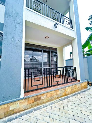 a balcony of a house with a railing at Apartment unit- Urban chills in Bulindo