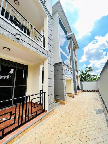 an image of a house with a balcony at Apartment unit- Urban chills in Bulindo