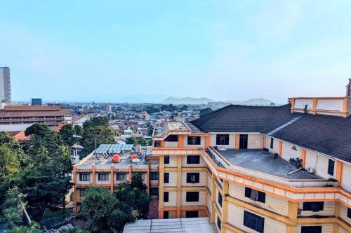 an overhead view of a city with buildings at Cottonwood Midcentury Apartment at Majesty 811 in Bandung
