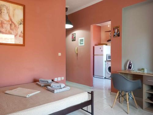 a living room with a bed and a kitchen at Cozy studio flat 1 bedroom-Very central location in Mytilene