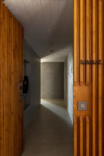 an empty hallway with a door in a building at Radisson Resort and Spa Lonavala in Lonavala